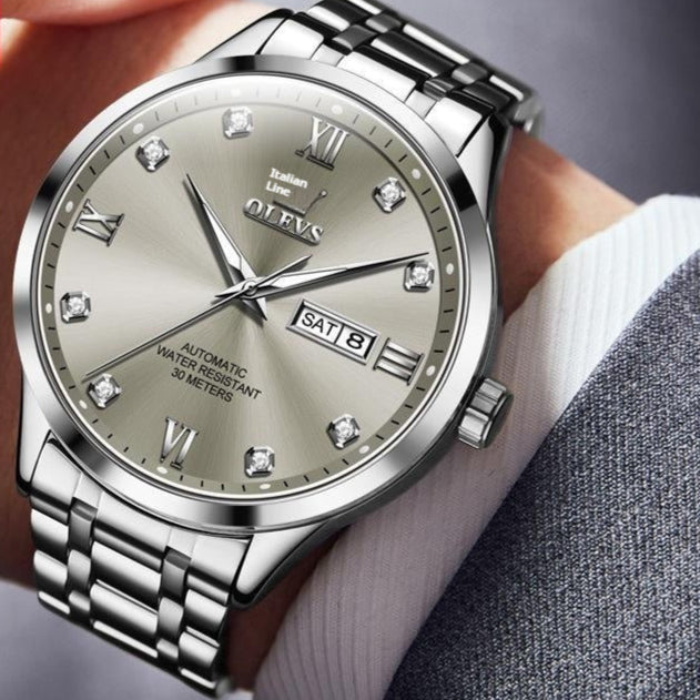 OLEVS Automatic Mechanical Watch features a stylish design with a silver dial, perfect for any occasion.